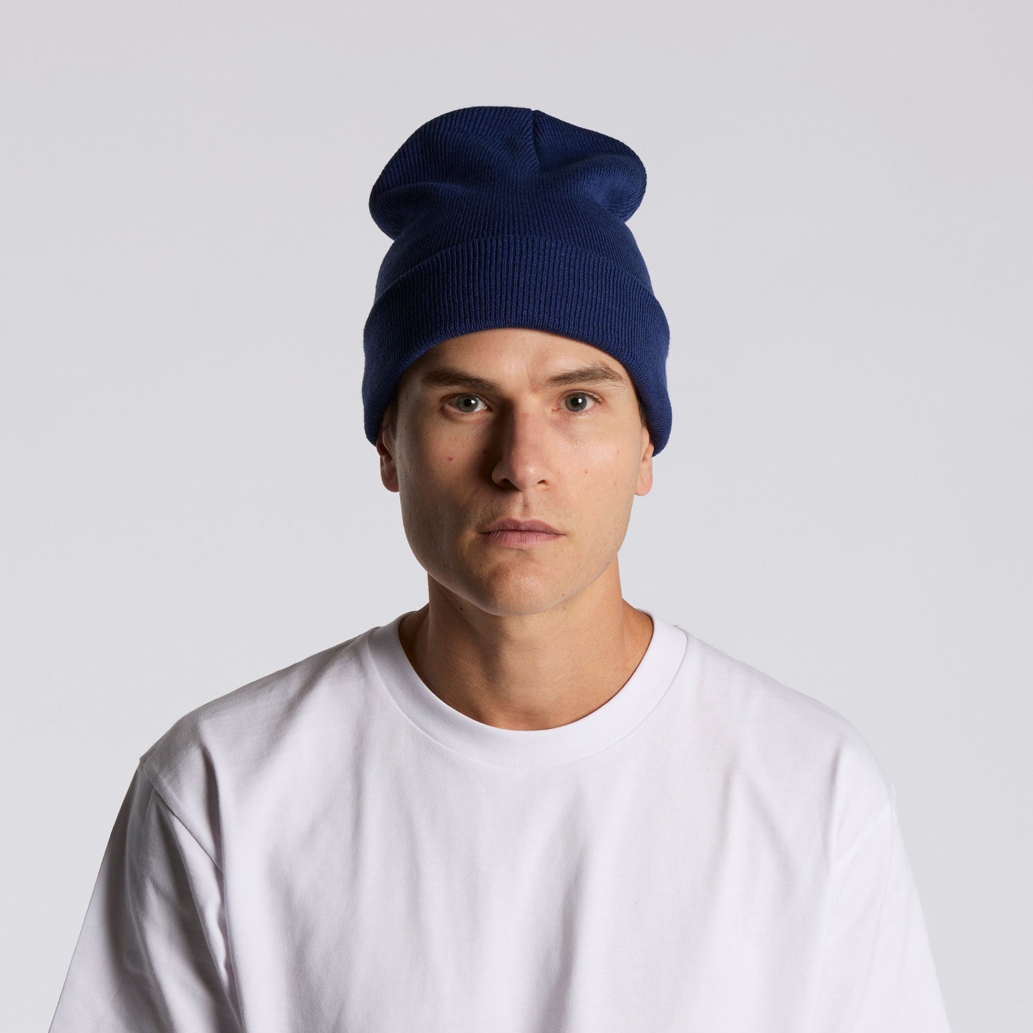 front image of model wearing as colour cuff beanie in colour cobalt