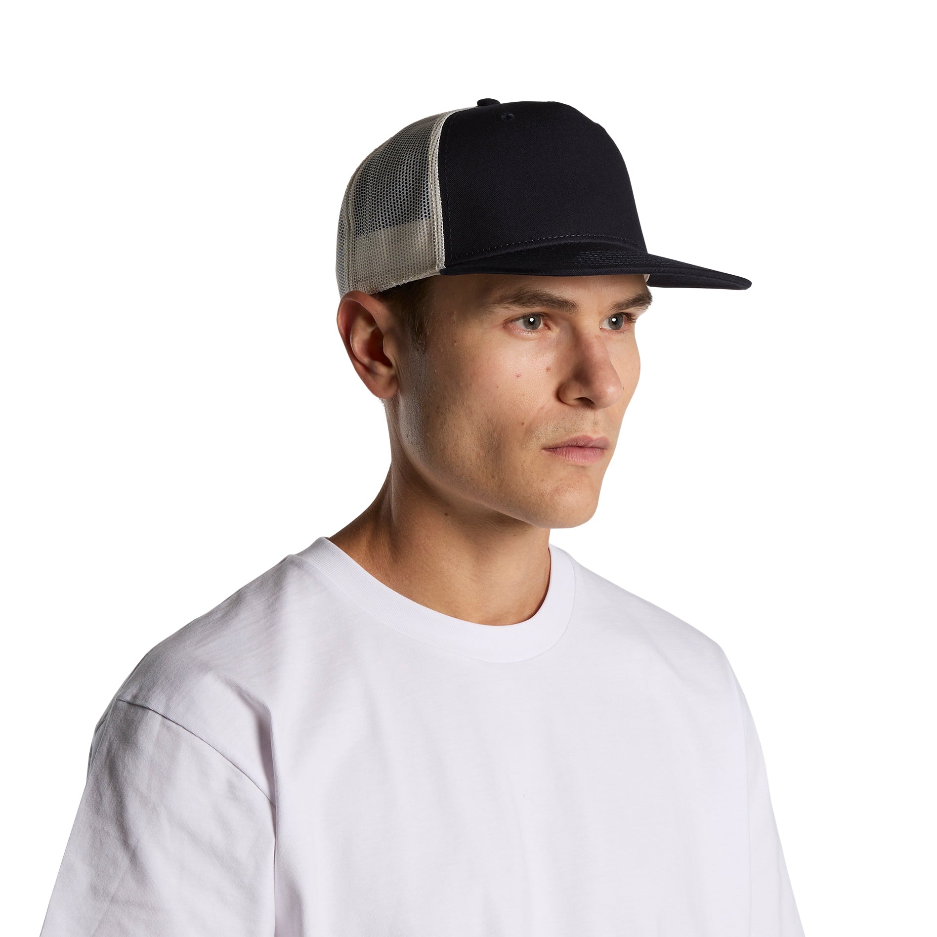 Image of model wearing AS Colour Stock Contrast Trucker Cap in black/ecru colour