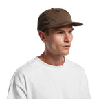 image of model wearing AS Colour Class Cap in Walnut