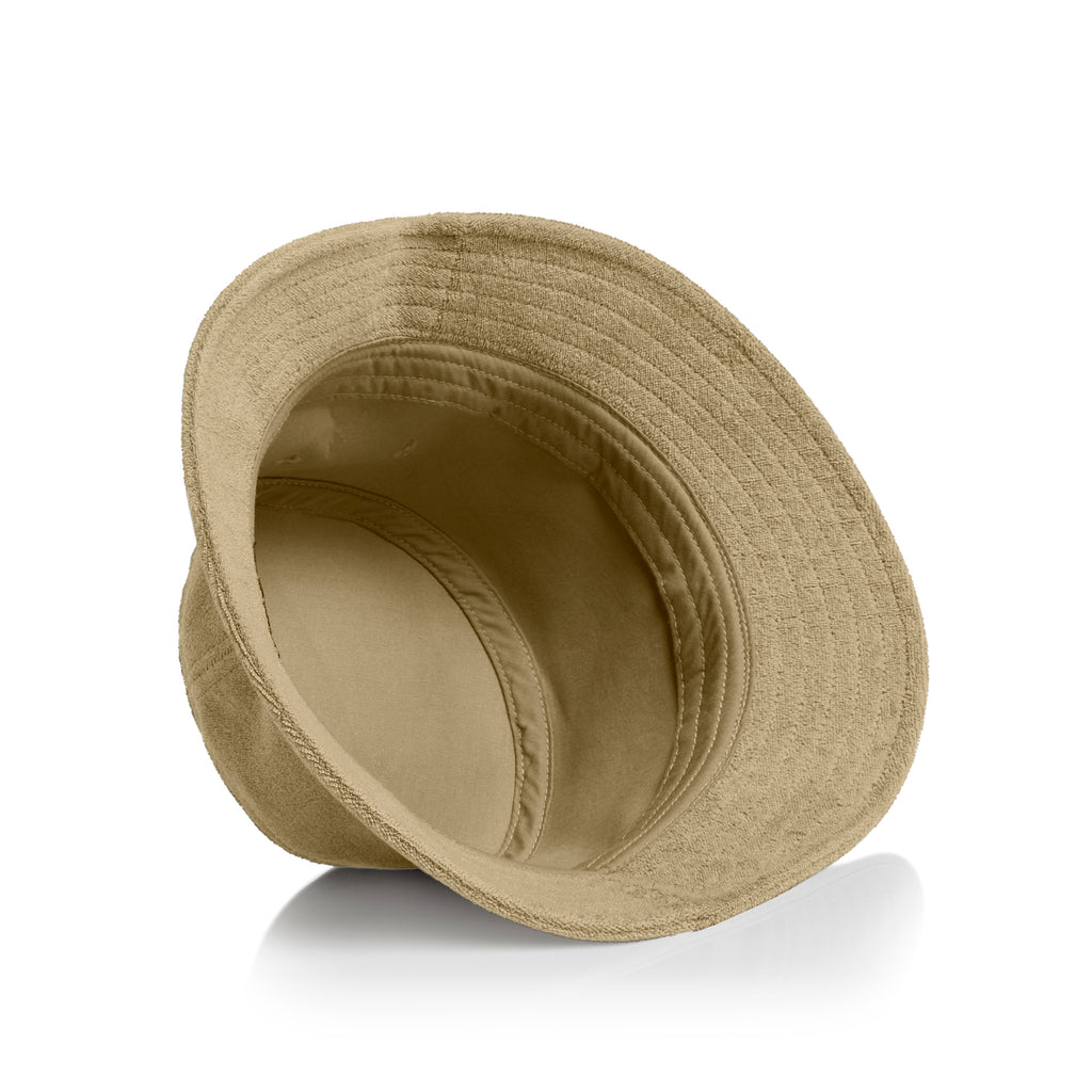 View of inside of khaki as colour terry bucket hat on a white background