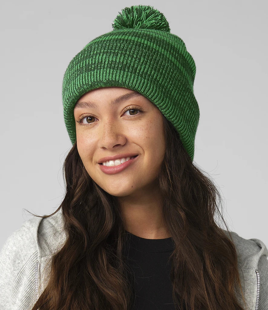 image of female model wearing the beechfield team stripe beanie in colour green photographed on a white background