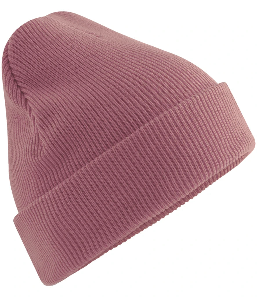 Product image of Beechfield Organic Cotton Original Heavyweight Cuffed Beanie in the colour rose viewed from the side on a white background