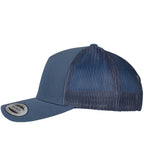 product image of flexfit 5 panel retro trucker cap in the colour navy viewed from the side photographed on a white background 