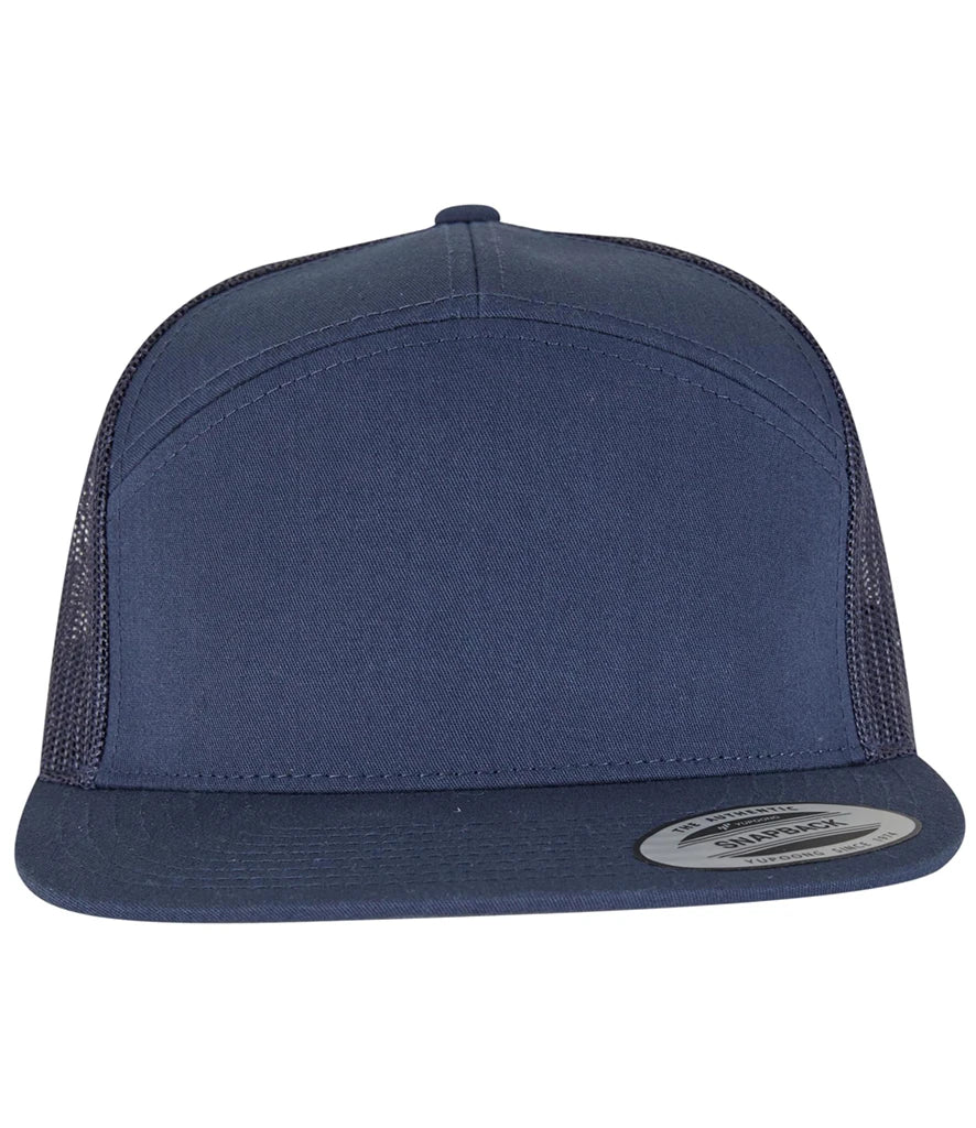 navy Flexfit 7 Panel Trucker Cap viewed from the front on a white background