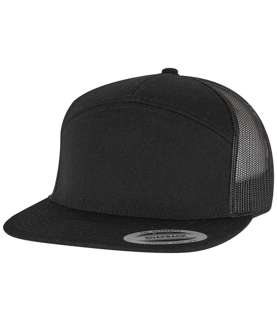 black Flexfit 7 Panel Trucker Cap viewed from the front on a white background