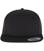 black Flexfit 7 Panel Trucker Cap viewed from the front on a white background