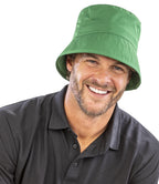 Man in grey polo shirt on a white background wearing Result Core Recycled Bound Edge Bucket Hat in kelly green