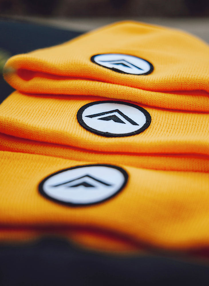 Orange beanies with embroidered logo